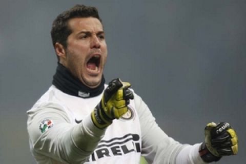 Inter Milan Brazilian goalkeeper Julio Cesar celebrates after his teammate Argentine forward Diego Milito, not pictured, scored during their Serie A soccer match between Inter Milan and AC Milan, at the San Siro stadium in Milan, Italy, Sunday, Jan. 24, 2010. (AP Photo/Luca Bruno)