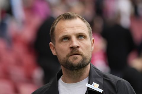 Mainz's head coach Bo Svensson walks before the German Bundesliga soccer match between 1. FSV Mainz 05 and FC Bayern Munich at the Mewa Arena in Mainz, Germany, Saturday, April 22, 2023. (AP Photo/Matthias Schrader)