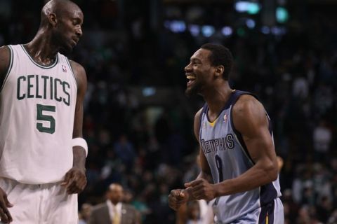 BOSTON, MA - MARCH 23:  Tony Allen #9 of the Memphis Grizzlies celebrates the win at the buzzer as Kevin Garnett #5 of the Boston Celtics stands by on March 23, 2011 at the TD Garden in Boston, Massachusetts.  The Memphis Grizzlies defeated the Boston Celtics 90-87. NOTE TO USER: User expressly acknowledges and agrees that, by downloading and/or using this Photograph, User is consenting to the terms and conditions of the Getty Images License Agreement.  (Photo by Elsa/Getty Images)