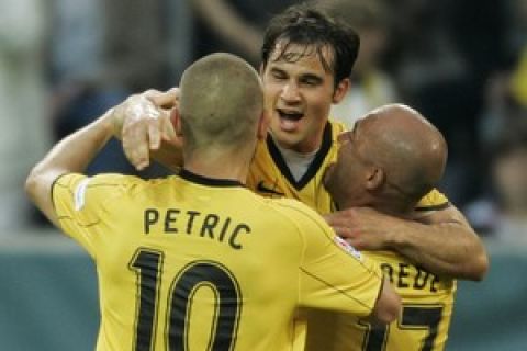 Dortmund's Hungarian midfielder Tamas Hajnal (C) celebrates scoring the 2-0 goal with his Croatian teammate Mladen Petric (L) and defender Dede during the Supercup football match between Borussia Dortmund and Bayerm Munich at the Signal Iduna Park in the western German city of Dortmund on July 23, 2008. AFP PHOTO DDP / JUERGEN SCHWARZ  GERMANY OUT (Photo credit should read JUERGEN SCHWARZ/AFP/Getty Images)