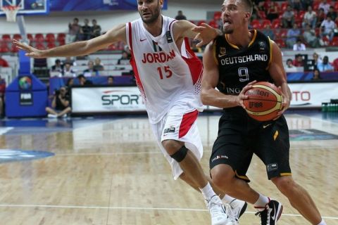 Germany's Steffen Hamann (R) and Jordan's Rasheim Wright (L) compete during the preliminary round match between Germany and Jordan at the FIBA World Basketball Championships at Kadir Has arena in Kayseri on September 2, 2010.  AFP PHOTO / BEHROUZ MEHRI (Photo credit should read BEHROUZ MEHRI/AFP/Getty Images)