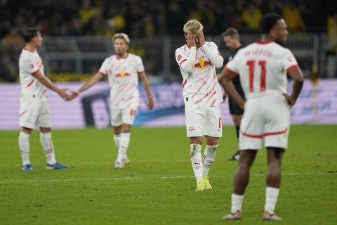 Leipzig players stand dejected after the German Bundesliga soccer match between Borussia Dortmund and RB Leipzig at the Signal-Iduna Park in Dortmund, Germany, Saturday, Nov. 2, 2024. (AP Photo/Martin Meissner)