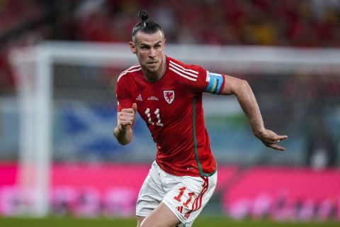 FILE - Wales' Gareth Bale runs during the World Cup group B soccer match between England and Wales, at the Ahmad Bin Ali Stadium in Al Rayyan , Qatar, Tuesday, Nov. 29, 2022.  The post-Gareth Bale era looked particularly daunting for Wales. A principality with a population of 3 million needed to replace its best ever player, a Real Madrid great, once the most expensive signing in soccer history. But the Welsh maybe neednt have worried because they are on the brink of qualifying for another major tournament. (AP Photo/Frank Augstein, File)