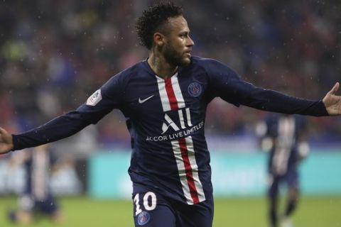 PSG's Neymar celebrates after scoring the opening goal of the game during the French League 1 soccer match between Lyon and Paris SG, at the Stade de Lyon in Decines, outside Lyon, France, Sunday, Sept. 22, 2019. (AP Photo/Laurent Cipriani)