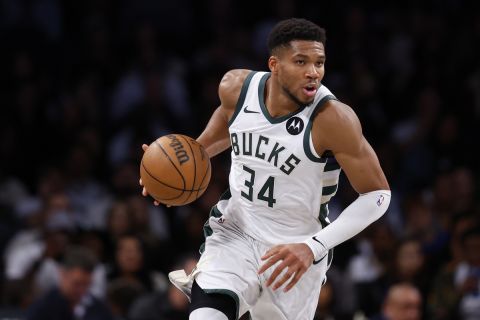 Milwaukee Bucks forward Giannis Antetokounmpo dribbles the ball against the Brooklyn Nets during the second half of a NBA basketball game, Sunday, Oct. 27, 2024, in New York. (AP Photo/Noah K. Murray)