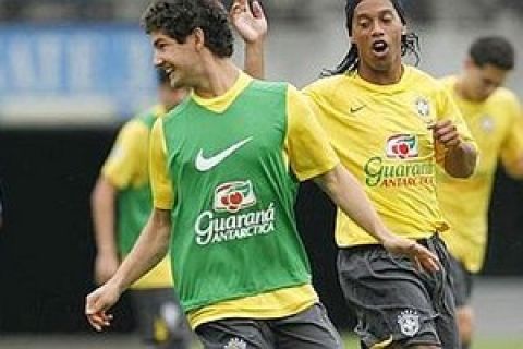 Brazil's Olympic soccer team players Pato, left, and Ronaldinho, right, participate in a training session on Friday July 25, 2008, in Singapore where they will play a friendly match against Singapore's team on July 28. (AP Photo/ Wong Maye-E)