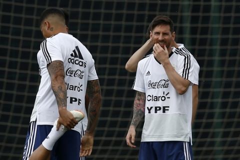 Argentina's Lionel Messi, right, attends a team training session at the Sports Center FC Barcelona Joan Gamper, in Sant Joan Despi, Spain, Wednesday, June 6, 2018. Argentina has called off a World Cup warmup match against Israel following protests by pro-Palestinian groups. A source at Argentina's football federation on Tuesday confirmed the cancellation of the international friendly scheduled to be played Saturday at Teddy Kollek Stadium in Jerusalem. (AP Photo/Manu Fernandez)