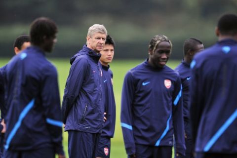 Arsenal's French manager Arsene Wenger attends a training session at Arsenal's training ground, London Colney, north London, on September 27, 2011, ahead the forthcoming UEFA Champions League group F football match against Olympiakos on Wednesday. AFP PHOTO/GLYN KIRK (Photo credit should read GLYN KIRK/AFP/Getty Images)