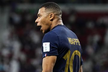 Kylian Mbappe celebrates scoring with the France national team