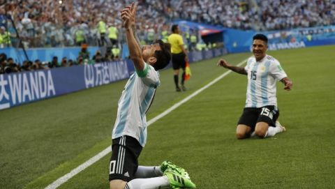 Argentina's Lionel Messi celebrates after scoring the opening goal of his team during the group D match between Argentina and Nigeria, at the 2018 soccer World Cup in the St. Petersburg Stadium in St. Petersburg, Russia, Tuesday, June 26, 2018. (AP Photo/Petr David Josek)