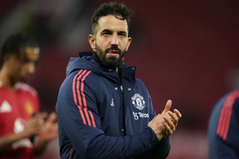 Manchester United's head coach Ruben Amorim applauds fans after the English Premier League soccer match between Manchester United and Bournemouth at the Old Trafford stadium in Manchester, England, Sunday, Dec. 22, 2024. (AP Photo/Dave Thompson)