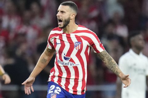 Atletico Madrid's Mario Hermoso celebrates after scoring his side's first goal during the Spanish La Liga soccer match between Atletico Madrid and Real Madrid at the Wanda Metropolitano stadium in Madrid, Spain, Sunday, Sept. 18, 2022. (AP Photo/Manu Fernandez)