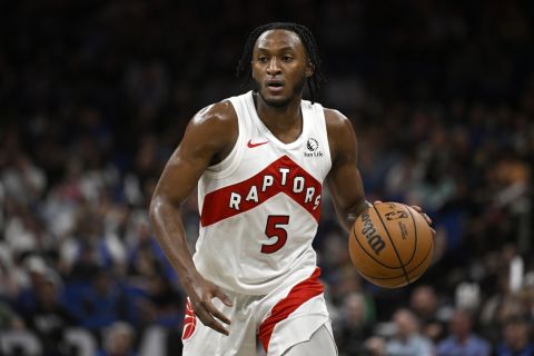 Toronto Raptors guard Immanuel Quickley (5) brings the ball up the court during the second half of an NBA basketball game against the Orlando Magic, Sunday, March 17, 2024, in Orlando, Fla. (AP Photo/Phelan M. Ebenhack)