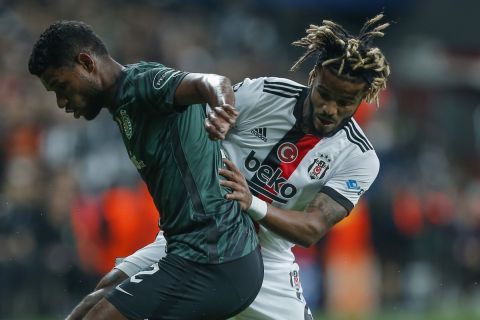 Sporting's Matheus Reis, left, vies for the ball with Besiktas' Valentin Rosier during Champions League group C soccer match between Besiktas and Sporting Lisbon at the Vodafone Park Stadium in Istanbul, Turkey, Tuesday, Oct. 19, 2021. (AP Photo)