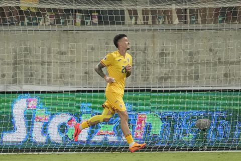 Romania's Dennis Man celebrates after scoring during the Nations League soccer match between Cyprus and the Romania at the AEK Arena in Larnaca, Cyprus, Saturday, Oct. 12, 2024. (AP Photo/Petros Karadjias)