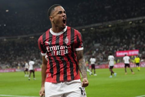 AC Milan's Noah Okafor celebrates after scoring his side's second goal during the Serie A soccer match between AC Milan and Torino at the San Siro stadium, in Milan, Italy, Saturday, Aug. 17, 2024. (AP Photo/Antonio Calanni)