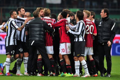 AC Milan and Juventus players argue on February 25, 2012 at the end of a Serie A football match at the San Siro stadium in Milan. AFP PHOTO / GIUSEPPE CACACE (Photo credit should read GIUSEPPE CACACE/AFP/Getty Images)