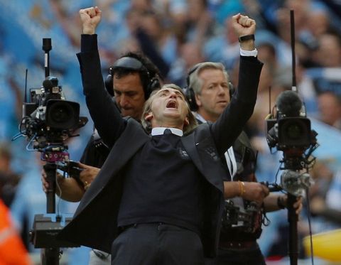 Manchester City's manager  Roberto Mancini (C) celebrates after his side beat Stoke 1-0 during the FA Cup final football match between Manchester City and Stoke City at Wembley Stadium in London, on May 14, 2011. AFP PHOTO / ADRIAN DENNIS
NOT FOR MARKETING OR ADVERTISING USE/RESTRICTED TO EDITORIAL USE (Photo credit should read ADRIAN DENNIS/AFP/Getty Images)