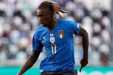 Italy's Moise Kean controls the ball during the UEFA Nations League third place soccer match between Italy and Belgium at the Juventus stadium, in Turin, Italy, Sunday, Oct. 10, 2021. (AP Photo/Antonio Calanni)