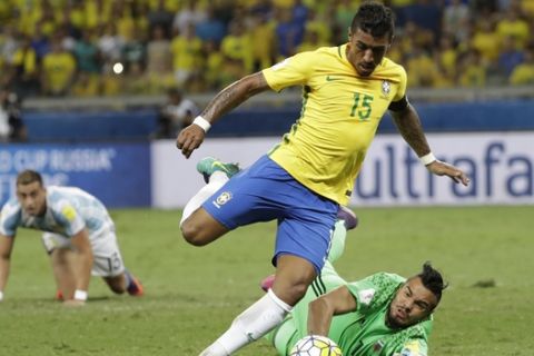 Brazil's Paulinho dribbles past Argentina goalkeeper Sergio Romero during a 2018 World Cup qualifying soccer match at the Mineirao stadium in Belo Horizonte, Brazil, Thursday Nov. 10, 2016.(AP Photo/Andre Penner)