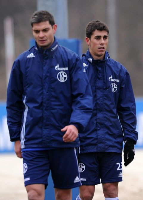 Schalke's new recruit Greek striker Angelos Charisteas (L) and Brazilian defender Danilo Avelar take part in a training session of German first division Bundesliga club Schalke 04 on February 1, 2011 in Gelsenkirchen, western Germany. Bundesliga side Schalke 04 on Sunday (January 30, 2011) signed Charisteas until the end of the season. Avelar, under contract with Ukrainian club Karpaty Lviv, was lent to Schalke 04 until the end of the season.    AFP PHOTO / PATRIK STOLLARZ (Photo credit should read PATRIK STOLLARZ/AFP/Getty Images)