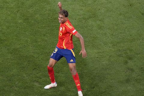 Spain's Lamine Yamal celebrates after scoring his side's opening goal during a semifinal match between Spain and France at the Euro 2024 soccer tournament in Munich, Germany, Tuesday, July 9, 2024. (AP Photo/Ariel Schalit)