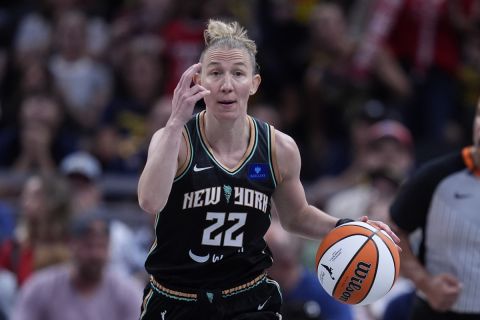 New York Liberty's Courtney Vandersloot dribbles during the first half of a WNBA basketball game against the Indiana Fever, Saturday, July 6, 2024, in Indianapolis. (AP Photo/Darron Cummings)