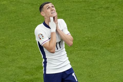 England's Phil Foden reacts after a missed chance to score during a Group C match between Denmark and England at the Euro 2024 soccer tournament in Frankfurt, Germany, Thursday, June 20, 2024. (AP Photo/Darko Vojinovic)