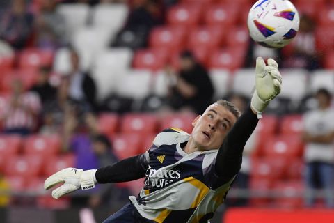 Real Madrid's goalkeeper Andriy Lunin warms up prior the Spanish La Liga soccer match between Athletic Club and Real Madrid at the San Mames stadium in Bilbao, Spain, Saturday, Aug. 12, 2023. (AP Photo/Alvaro Barrientos)