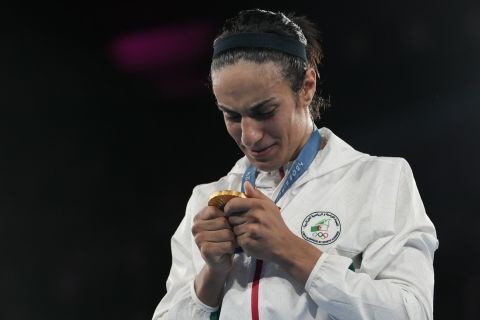 Gold medalist Algeria's Imane Khelif attends a medals ceremony for the women's 66 kg final boxing match at the 2024 Summer Olympics, Friday, Aug. 9, 2024, in Paris, France. (AP Photo/Ariana Cubillos)