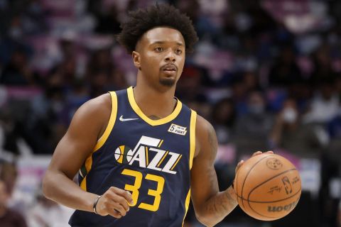 Utah Jazz's Elijah Hughes handles the ball in the first half of a preseason NBA basketball game against the Dallas Mavericks in Dallas, Wednesday, Oct. 6, 2021. (AP Photo/Michael Ainsworth)