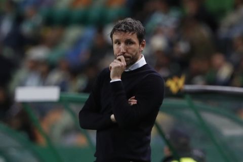 PSV head coach Mark van Bommel follows the action from the side line during the Europa League group D soccer match between Sporting CP and PSV Eindhoven at the Alvalade stadium in Lisbon, Thursday, Nov. 28, 2019. (AP Photo/Armando Franca)