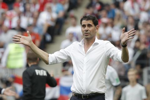 Spain head coach Fernando Hierro gestures as he watches his side play during the round of 16 match between Spain and Russia at the 2018 soccer World Cup at the Luzhniki Stadium in Moscow, Russia, Sunday, July 1, 2018. (AP Photo/Manu Fernandez)