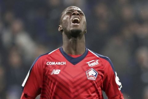 Lille's Nicolas Pepe reacts during a French League One soccer match against Lyon in Decines, near Lyon, central France, Sunday, May 5, 2019. (AP Photo/Laurent Cipriani)