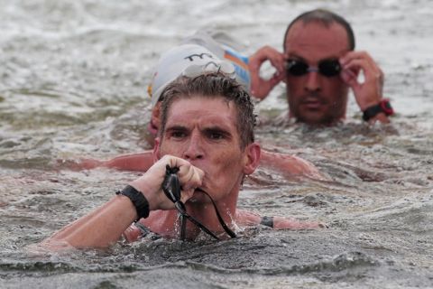 SHANGHAI, CHINA - JULY 20:  Spyros Gianniotis (L) of Greece celebrates after he finished first to win the gold medal in the Men's Open Water 10km during Day Five of the 14th FINA World Championships at the Jinshan City Beach on July 20, 2011 in Shanghai, China. Gianniottis finished with a time of 1:54:24.7.  (Photo by Adam Pretty/Getty Images)