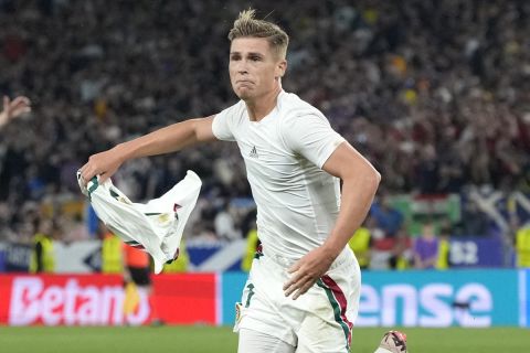 CORRECTS ID TO KEVIN CSOBOTH - Hungary's Kevin Csoboth celebrates at the end of a Group A match between Scotland and Hungary at the Euro 2024 soccer tournament in Stuttgart, Germany, Sunday, June 23, 2024.(AP Photo/Antonio Calanni)