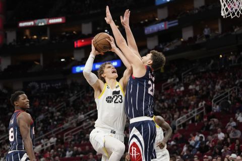 Utah Jazz's Lauri Markkanen (23) goes up for a shot as Houston Rockets' Alperen Sengun (28) defends during the second half of an NBA basketball game Thursday, Jan. 5, 2023, in Houston. Utah won 131-114. (AP Photo/David J. Phillip)