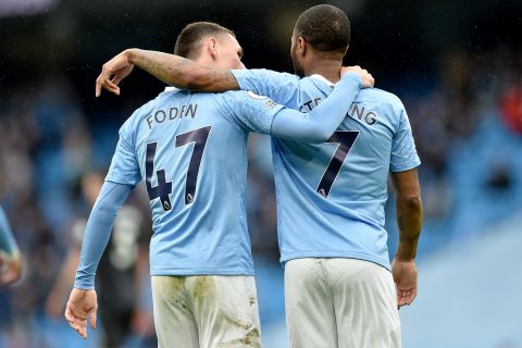 Manchester City's Phil Foden, left, and Manchester City's Raheem Sterling celebrate scoring their side's third goal during the English Premier League soccer match between Manchester City and Everton at the Etihad stadium in Manchester, Sunday, May 23, 2021.(Peter Powel/Pool via AP)