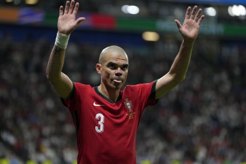 Portugal's Pepe waves to the fans as he leaves the pitch during a round of sixteen match between Portugal and Slovenia at the Euro 2024 soccer tournament in Frankfurt, Germany, Monday, July 1, 2024. (AP Photo/Matthias Schrader)