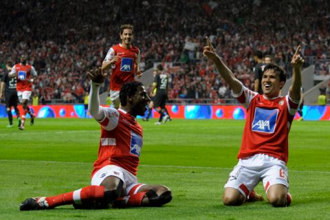 SC Braga's Brazilian midfielder Marcio da Costa "Mossoro" (R) celebrates with teammate Brazilian defender Douglas Ferreira "Douglao" (L) after scoring a goal during the Portuguese super league football match SC Braga vs Academica at the Municipal Stadium in Braga, on March 26, 2012. AFP PHOTO / MIGUEL RIOPA (Photo credit should read MIGUEL RIOPA/AFP/Getty Images)