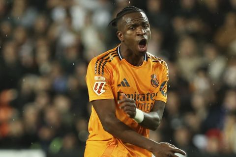 Real Madrid's Vinicius Junior gestures during a Spanish La Liga soccer match against Valencia at Mestalla stadium in Valencia, Spain, Friday, Jan. 3, 2025. (AP Photo/Alberto Saiz)