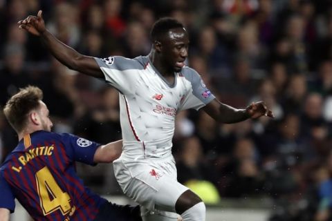 Barcelona's Ivan Rakitic, left, tackles Liverpool's Naby Keita during the Champions League semifinal, first leg, soccer match between FC Barcelona and Liverpool at the Camp Nou stadium in Barcelona Spain, Wednesday, May 1, 2019. (AP Photo/Joan Monfort)