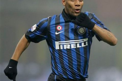 Inter Milan Brazilian defender Maicon celebrates after scoring during the Italian Cup eight final soccer match between Inter Milan and Genoa, at the San Siro stadium in Milan, Italy, Thursday, Jan. 19, 2012. (AP Photo/Luca Bruno)