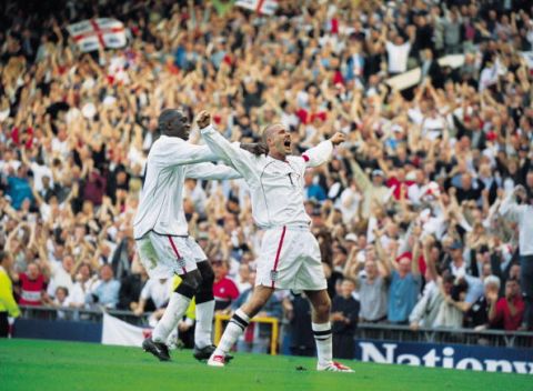 6 Oct 2001:  David Beckham of England celebrates his injury time equalising goal during the World Cup Group 9 Qualifier between England and Greece at Old Trafford in Manchester, England. England sealed qualification after the game ended 2-2.   \ MandatoryCredit: Shaun Botterill /Allsport