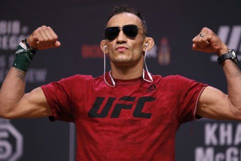 Tony Ferguson poses during a ceremonial weigh-in for the UFC 229 mixed martial arts fight Friday, Oct. 5, 2018, in Las Vegas. Ferguson is scheduled to fight Anthony Pettis Saturday in Las Vegas. (AP Photo/John Locher)