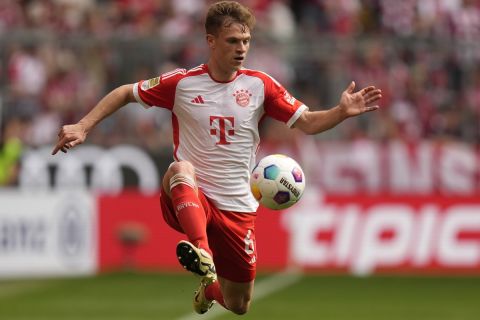 Bayern's Joshua Kimmich is in action during the German Bundesliga soccer match between Bayern Munich and Cologne at the Allianz Arena in Munich, Germany, Saturday, April 13, 2024. (AP Photo/Matthias Schrader)