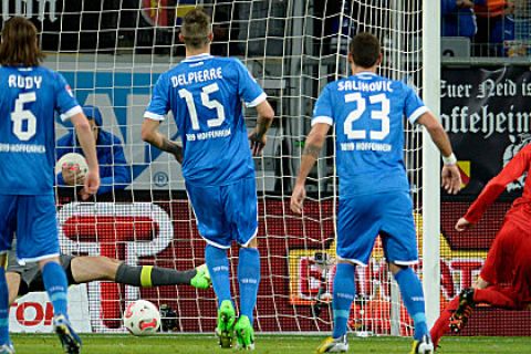 SINSHEIM, GERMANY - NOVEMBER 25:  Lars Bender of Leverkusen scores his team's first goal during the Bundesliga match between TSG 1899 Hoffenheim and Bayer 04 Leverkusen at Rhein-Neckar-Arena on November 25, 2012 in Sinsheim, Germany.  (Photo by Dennis Grombkowski/Bongarts/Getty Images)