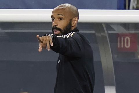 FILE - Montreal Impact head coach Thierry Henry shouts from the bench during the second half of an MLS soccer match against the New England Revolution in Foxborough, Mass., in this Wednesday, Sept. 23, 2020, file photo. Thierry Henry has resigned as coach of Montreal in Major League Soccer after one season on Thursday, Feb. 25, 2021, citing family reasons. (AP Photo/Steven Senne, File)