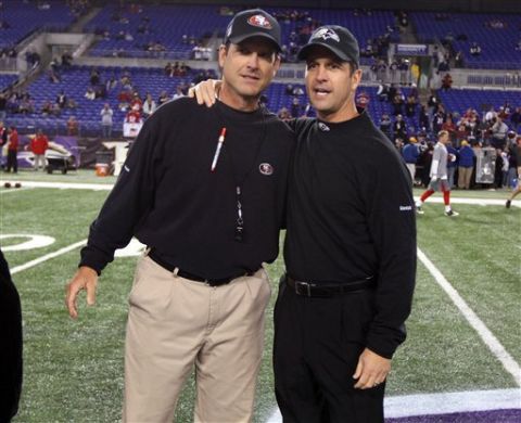 San Francisco 49ers head coach Jim Harbaugh and Baltimore Ravens head coach John Harbaugh prior to an NFL football game at M&T Bank Stadium in Baltimore, Thursday, Nov. 24, 2011. The Harbaughs became the first brothers to face each other as NFL head coaches. (AP Photo/Ben Liebenberg)