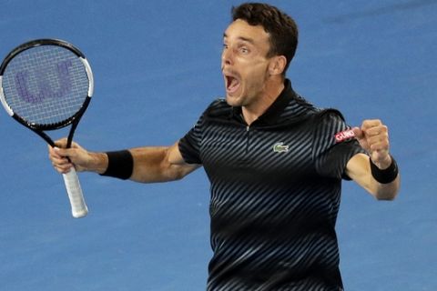 Spain's Roberto Bautista Agut celebrates after defeating Croatia's Marin Cilic in their fourth round match at the Australian Open tennis championships in Melbourne, Australia, Sunday, Jan. 20, 2019. (AP Photo/Kin Cheung)